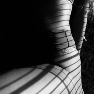 Abstract silhouette of a human body with energy lines flowing through it.